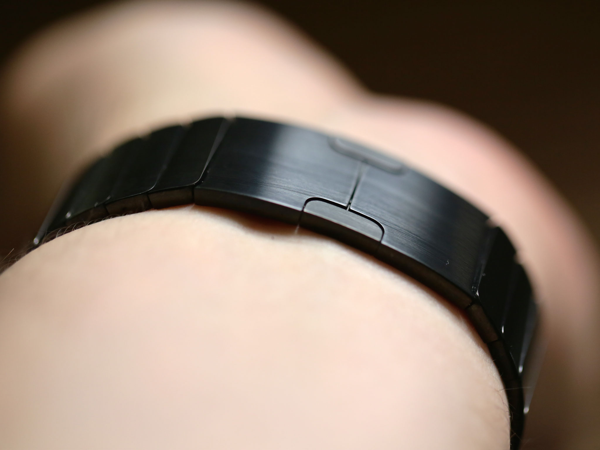 link-bracelet-on-clasp-black-steel-macro.jpg